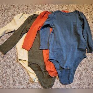 Four Primary long sleeve babysuits